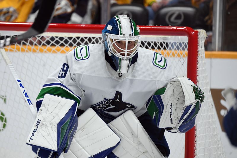 Dec 19, 2023; Nashville, Tennessee, USA; Vancouver Canucks goaltender Casey DeSmith (29) waits for a face off during the third period against the Nashville Predators at Bridgestone Arena. Mandatory Credit: Christopher Hanewinckel-USA TODAY Sports