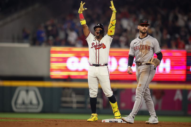 Apr 6, 2024; Atlanta, Georgia, USA; Atlanta Braves right fielder Ronald Acuna Jr. (13) celebrates after a RBI single against the Arizona Diamondbacks in the eighth inning at Truist Park. Mandatory Credit: Brett Davis-USA TODAY Sports