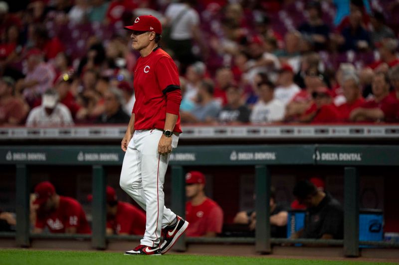 Sep 6, 2023; Cincinnati, Ohio, USA; Cincinnati Reds manager David Bell approaches the mound in the fifth inning of the MLB baseball game between the Cincinnati Reds and the Seattle Mariners at Great American Ball Park. Mandatory Credit: Albert Cesare-USA TODAY Sports