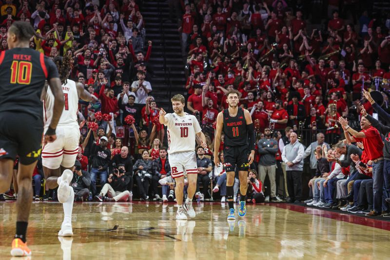 Jan 5, 2023; Piscataway, New Jersey, USA; Rutgers Scarlet Knights guard Cam Spencer (10) celebrates after basket in front of center Clifford Omoruyi (11) and forward Julian Reese (10) during the second half at Jersey Mike's Arena. Mandatory Credit: Vincent Carchietta-USA TODAY Sports