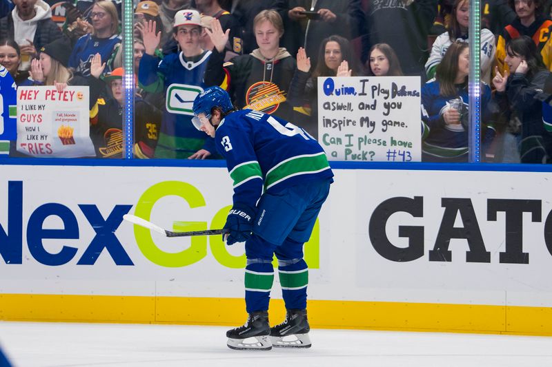 Nov 15, 2023; Vancouver, British Columbia, CAN; Vancouver fans cheer on Canucks defenseman Quinn Hughes (43) during warm up prior to a game against the New York Islanders at Rogers Arena. Mandatory Credit: Bob Frid-USA TODAY Sports