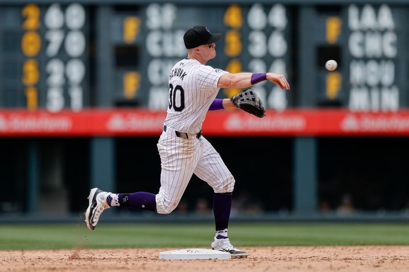 Jul 7, 2024; Denver, Colorado, USA; Colorado Rockies second baseman Aaron Schunk (30) throws to first in the ninth inning against the Kansas City Royals at Coors Field. Mandatory Credit: Isaiah J. Downing-USA TODAY Sports