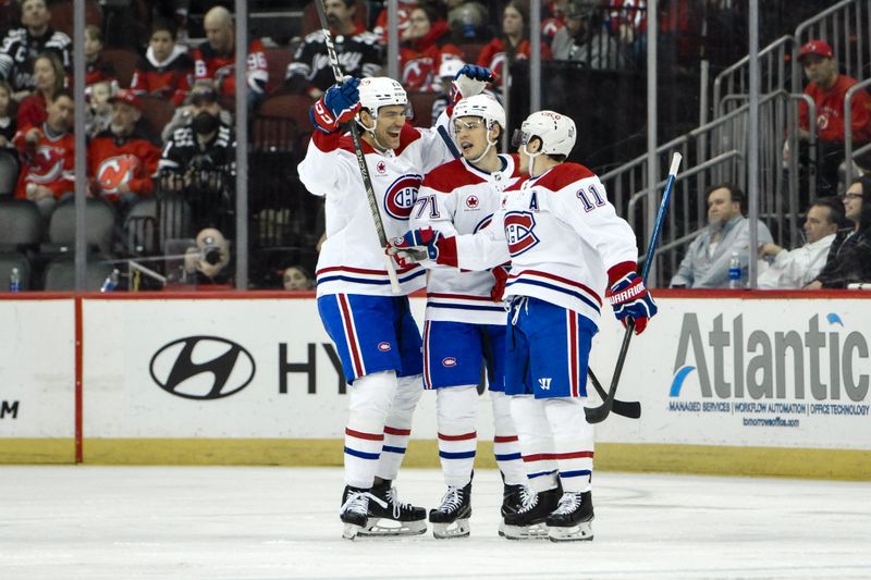 Feb 24, 2024; Newark, New Jersey, USA; Montreal Canadiens right wing Brendan Gallagher (11) celebrates with teammates after scoring a goal against the New Jersey Devils during the second period at Prudential Center. Mandatory Credit: John Jones-USA TODAY Sports