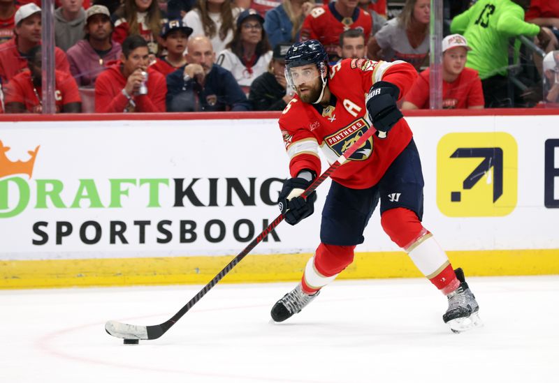 May 11, 2025; Sunrise, Florida, USA; Florida Panthers defenseman Aaron Ekblad (5) passes the puck against the Toronto Maple Leafs during the second period in game four of the second round of the 2025 Stanley Cup Playoffs at Amerant Bank Arena. Mandatory Credit: Kim Klement Neitzel-Imagn Images