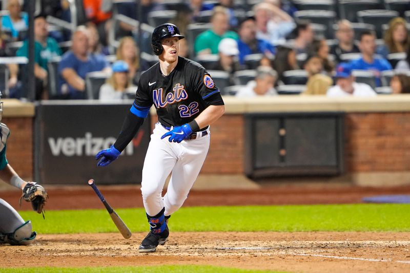 Sep 1, 2023; New York City, New York, USA; New York Mets third baseman Brett Baty (22) hits a single against the Seattle Mariners during the seventh inning at Citi Field. Mandatory Credit: Gregory Fisher-USA TODAY Sports