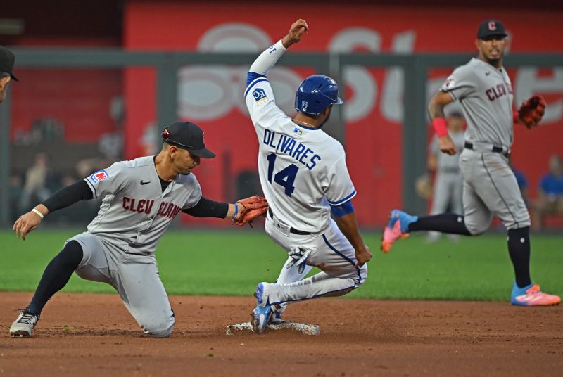 Sep 19, 2023; Kansas City, Missouri, USA; Cleveland Guardians second baseman Andres Gimenez (0) tags out Kansas City Royals Edward Olivares (14) attempting to steal second base in the first inning at Kauffman Stadium. Mandatory Credit: Peter Aiken-USA TODAY Sports