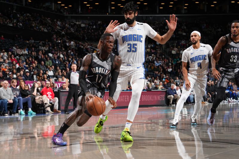 BROOKLYN, NY - DECEMBER 1: Dennis Schroder #17 of the Brooklyn Nets drives to the basket during the game against the Orlando Magic on December 1, 2024 at Barclays Center in Brooklyn, New York. NOTE TO USER: User expressly acknowledges and agrees that, by downloading and or using this Photograph, user is consenting to the terms and conditions of the Getty Images License Agreement. Mandatory Copyright Notice: Copyright 2024 NBAE (Photo by Jesse D. Garrabrant/NBAE via Getty Images)