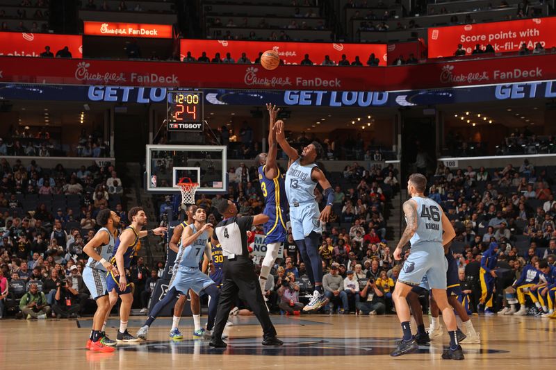 MEMPHIS, TN - FEBRUARY 2: Draymond Green #23 of the Golden State Warriors and Jaren Jackson Jr. #13 of the Memphis Grizzlies go for the opening tip-off on February 2, 2024 at FedExForum in Memphis, Tennessee. NOTE TO USER: User expressly acknowledges and agrees that, by downloading and or using this photograph, User is consenting to the terms and conditions of the Getty Images License Agreement. Mandatory Copyright Notice: Copyright 2024 NBAE (Photo by Joe Murphy/NBAE via Getty Images)