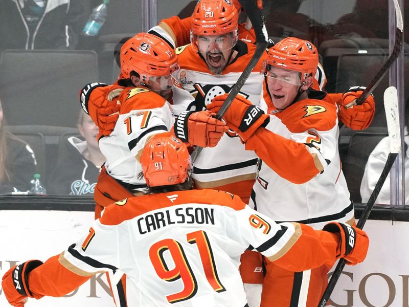 Oct 11, 2025; San Jose, California, USA; Anaheim Ducks left wing Chris Kreider (center) celebrates with left wing Alex Killorn (17) and center Leo Carlsson (91) and defenseman Jackson LaCombe (right) after scoring a goal against the San Jose Sharks during the third period at SAP Center at San Jose. Mandatory Credit: Darren Yamashita-Imagn Images