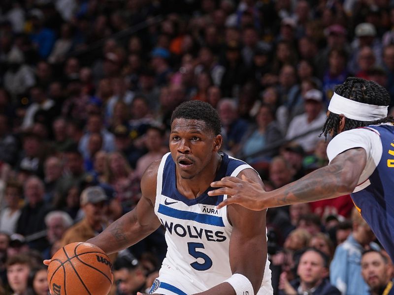 DENVER, CO - APRIL 10:  Anthony Edwards #5 of the Minnesota Timberwolves dribbles the ball during the game aDenver Nuggets on April 10, 2024 at the Ball Arena in Denver, Colorado. NOTE TO USER: User expressly acknowledges and agrees that, by downloading and/or using this Photograph, user is consenting to the terms and conditions of the Getty Images License Agreement. Mandatory Copyright Notice: Copyright 2024 NBAE (Photo by Bart Young/NBAE via Getty Images)