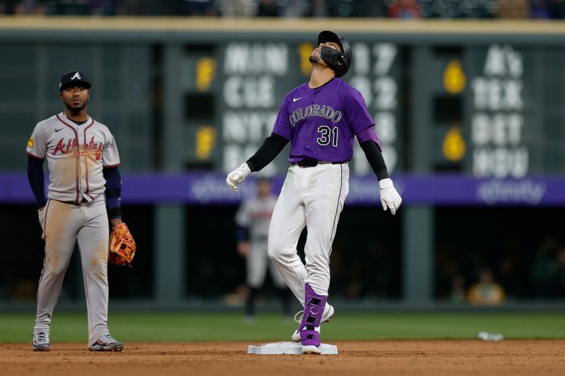 Apr 28, 2025; Denver, Colorado, USA; Colorado Rockies shortstop Alan Trejo (31) reacts after his ball hit off the wall for a double in the fourth inning against the Atlanta Braves at Coors Field. Mandatory Credit: Isaiah J. Downing-Imagn Images