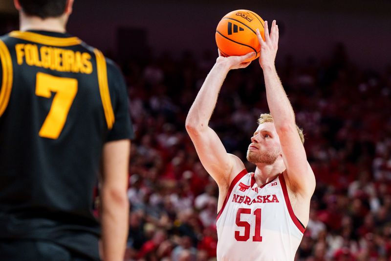 Mar 8, 2026; Lincoln, Nebraska, USA; Nebraska Cornhuskers forward Rienk Mast (51) shoots a free throw against Iowa Hawkeyes forward Alvaro Folgueiras (7) during the first half at Pinnacle Bank Arena. Mandatory Credit: Dylan Widger-Imagn Images Mar 8, 2026; Lincoln, Nebraska, USA; Nebraska Cornhuskers forward Rienk Mast (51) shoots a free throw against Iowa Hawkeyes forward Alvaro Folgueiras (7) during the first half at Pinnacle Bank Arena. Mandatory Credit: Dylan Widger-Imagn Images