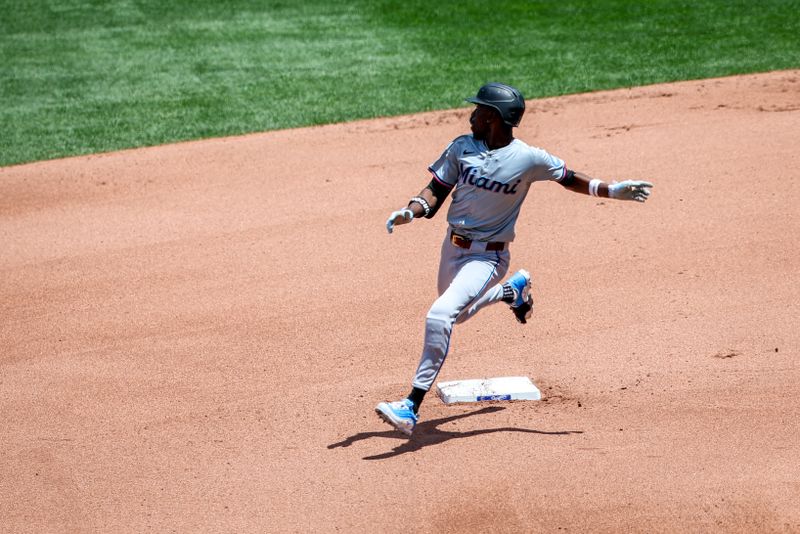 Jun 26, 2024; Kansas City, Missouri, USA; Miami Marlins outfielder Nick Gordon (1) rounds the bases after a hit against the Kansas City Royals during the fifth inning at Kauffman Stadium. Mandatory Credit: William Purnell-USA TODAY Sports
