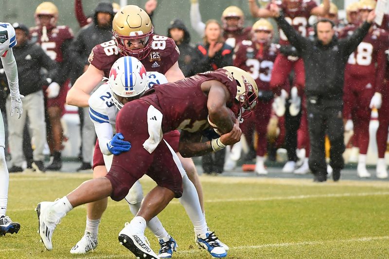 Dec 28, 2023; Boston, MA, USA; Boston College Eagles running back Kye Robichaux (5) scores a touchdown against the Southern Methodist Mustangs during the first half at Fenway Park. Mandatory Credit: Eric Canha-USA TODAY Sports