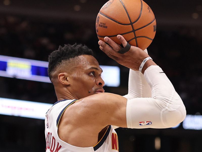 CHICAGO, ILLINOIS - JANUARY 27: Russell Westbrook #4 of the Denver Nuggets shoots a three pointer against the Chicago Bulls during the first half at the United Center on January 27, 2025 in Chicago, Illinois. NOTE TO USER: User expressly acknowledges and agrees that, by downloading and or using this photograph, User is consenting to the terms and conditions of the Getty Images License Agreement.  (Photo by Michael Reaves/Getty Images)