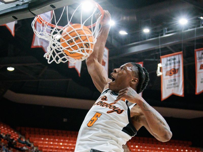 Feb 17, 2024; Stillwater, Oklahoma, USA; Oklahoma State Cowboys guard Quion Williams (5) dunks the ball during the first half against the Brigham Young Cougars at Gallagher-Iba Arena. Mandatory Credit: William Purnell-USA TODAY Sports