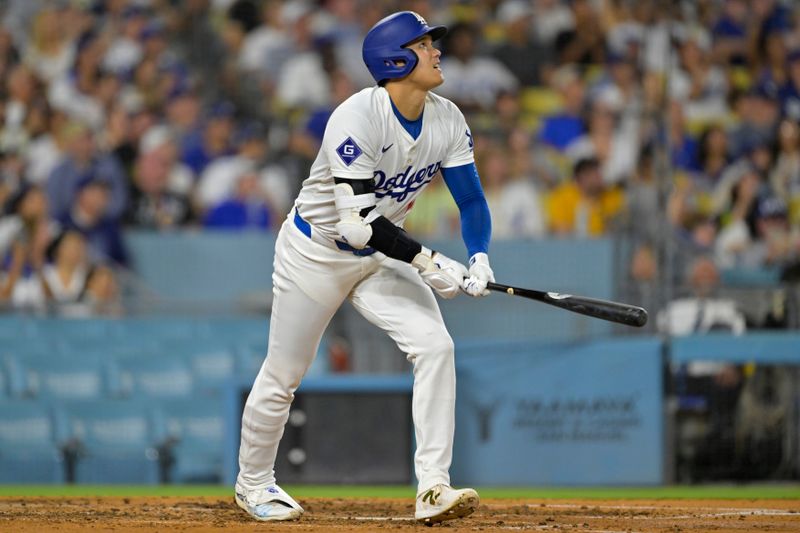 Sep 6, 2024; Los Angeles, California, USA;  Los Angeles Dodgers designated hitter Shohei Ohtani (17) watches the flight of the ball on his 45th home run on the season in the sixth inning against the Cleveland Guardians at Dodger Stadium. Mandatory Credit: Jayne Kamin-Oncea-Imagn Images