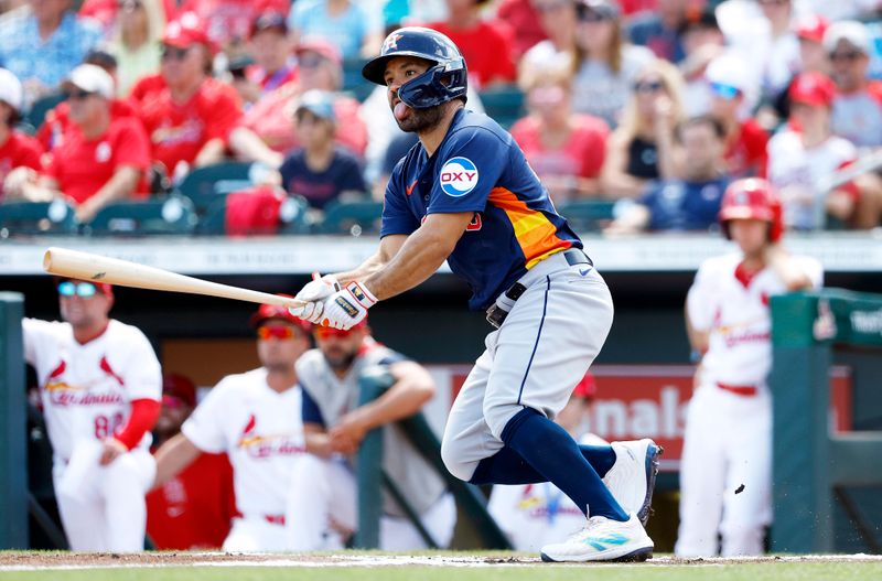 Mar 21, 2024; Jupiter, Florida, USA; Houston Astros second baseman Jose Altuve (27) reacts as he doubles against the St. Louis Cardinals in the first inning at Roger Dean Chevrolet Stadium. Mandatory Credit: Rhona Wise-USA TODAY Sports