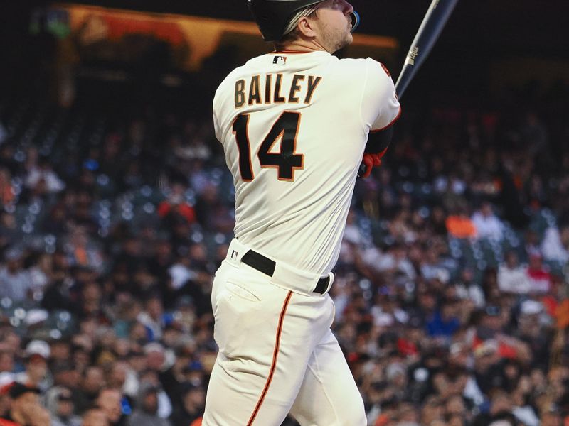 Aug 28, 2023; San Francisco, California, USA; San Francisco Giants catcher Patrick Bailey (14) follows the ball as he hits an RBI double against the Cincinnati Reds during the third inning at Oracle Park. Mandatory Credit: Kelley L Cox-USA TODAY Sports