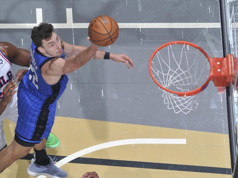 ORLANDO, FL - NOVEMBER 15: Franz Wagner #22 of the Orlando Magic shoots the ball during the game against the Philadelphia 76ers during the Emirates NBA Cup game on  November 15, 2024 at Kia Center in Orlando, Florida. NOTE TO USER: User expressly acknowledges and agrees that, by downloading and or using this photograph, User is consenting to the terms and conditions of the Getty Images License Agreement. Mandatory Copyright Notice: Copyright 2024 NBAE (Photo by Fernando Medina/NBAE via Getty Images)