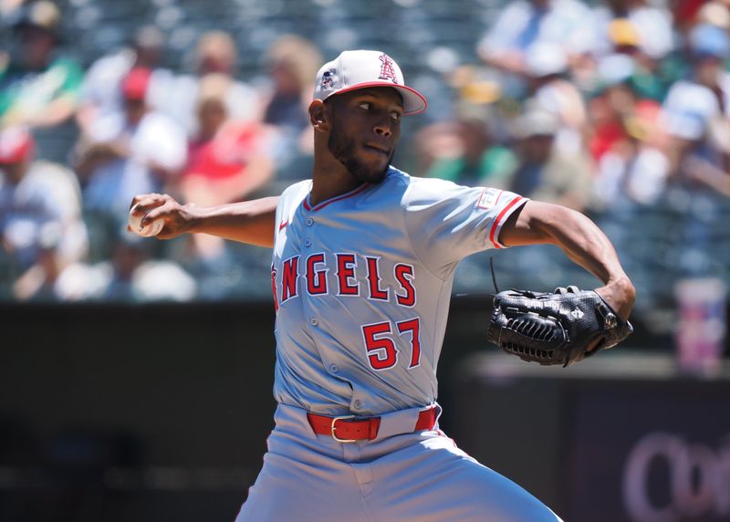 Jul 4, 2024; Oakland, California, USA; Los Angeles Angels starting pitcher Roansy Contreras (57) pitches the ball against the Oakland Athletics during the first inning at Oakland-Alameda County Coliseum. Mandatory Credit: Kelley L Cox-USA TODAY Sports