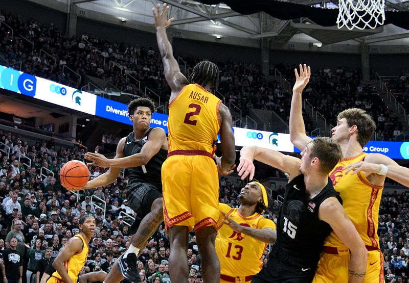 Jan 5, 2026; East Lansing, Michigan, USA;  Michigan State Spartans guard Jeremy Fears Jr. (1) drives into the paint, looking for a pass during the second half against the Southern California Trojans at Jack Breslin Student Events Center. Mandatory Credit: Dale Young-Imagn Images