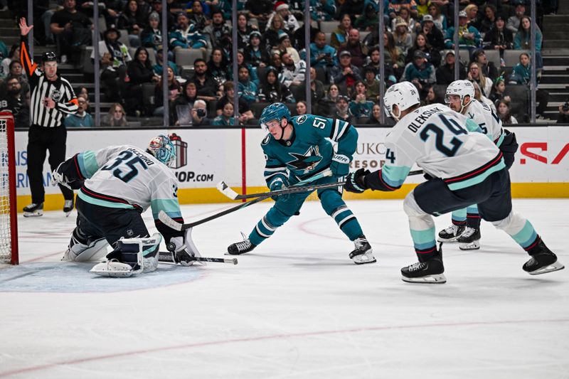 Dec 20, 2025; San Jose, California, USA; San Jose Sharks right wing Collin Graf (51) takes a shot on goal against Seattle Kraken goaltender Joey Daccord (35) during the second period at SAP Center at San Jose. Mandatory Credit: Justine Willard-Imagn Images