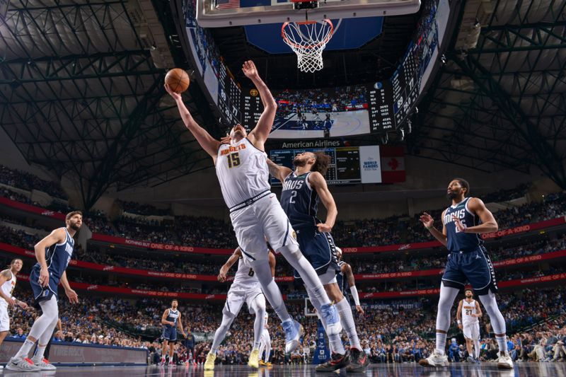 DALLAS, TX - JANUARY 12: Nikola Jokic #15 of the Denver Nuggets drives to the basket during the game against the Dallas Mavericks on January 12, 2025 at American Airlines Center in Dallas, Texas. NOTE TO USER: User expressly acknowledges and agrees that, by downloading and or using this photograph, User is consenting to the terms and conditions of the Getty Images License Agreement. Mandatory Copyright Notice: Copyright 2025 NBAE (Photo by Glenn James/NBAE via Getty Images)