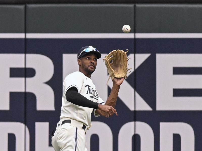 Sep 28, 2023; Minneapolis, Minnesota, USA; Minnesota Twins outfielder Michael Taylor (2) catches a fly ball against the Oakland Athletics during the seventh inning at Target Field. Mandatory Credit: Nick Wosika-USA TODAY Sports