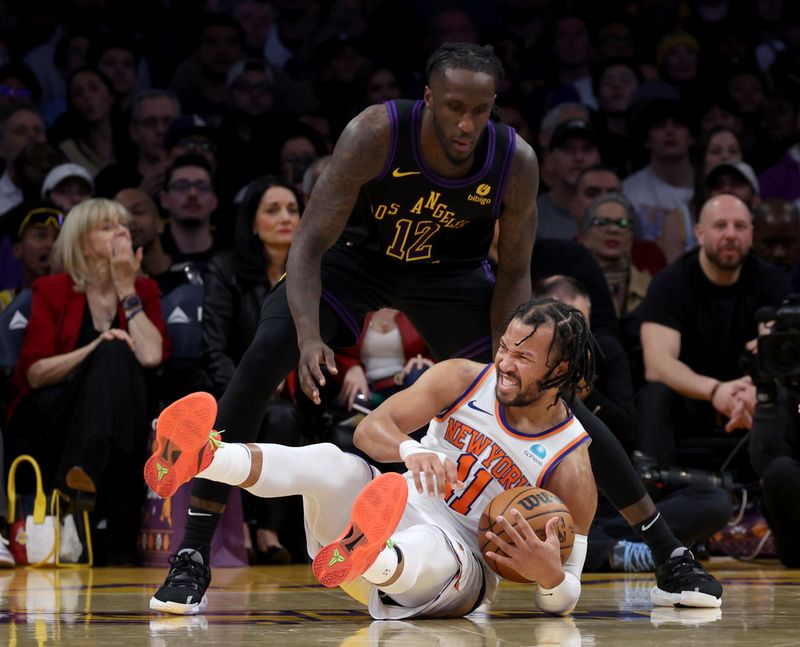 LOS ANGELES, CALIFORNIA - DECEMBER 18: Jalen Brunson #11 of the New York Knicks reacts after he is fouled by Taurean Prince #12 of the Los Angeles Lakers during a 114-109 Knicks win at Crypto.com Arena on December 18, 2023 in Los Angeles, California. NOTE TO USER: User expressly acknowledges and agrees that, by downloading and or using this photograph, User is consenting to the terms and conditions of the Getty Images License Agreement. (Photo by Harry How/Getty Images)