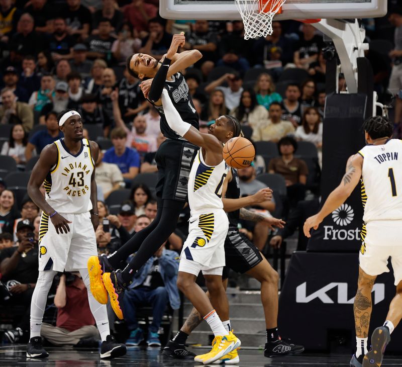 SAN ANTONIO, TX - MARCH 03: Victor Wembanyama #1 of the San Antonio Spurs is fouled by Benedict #00 of the Indiana Pacers in the first half at Frost Bank Center on March 3, 2024 in San Antonio, Texas. NOTE TO USER: User expressly acknowledges and agrees that, by downloading and or using this photograph, User is consenting to terms and conditions of the Getty Images License Agreement. (Photo by Ronald Cortes/Getty Images)