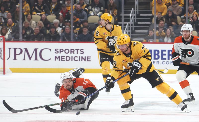 Jan 15, 2026; Pittsburgh, Pennsylvania, USA;  Pittsburgh Penguins defenseman Connor Clifton (75) moves the puck ahead of Philadelphia Flyers right wing Travis Konecny (11) during the first period at PPG Paints Arena. Mandatory Credit: Charles LeClaire-Imagn Images