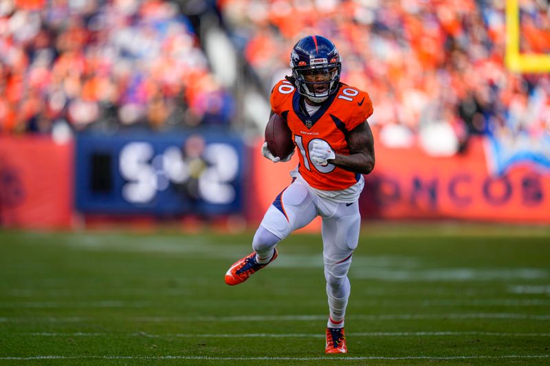 FILE - Denver Broncos wide receiver Jerry Jeudy (10) runs against the Los Angeles Chargers during an NFL football game, Sunday, Jan. 8, 2023, in Denver. A person familiar with the decision tells The Associated Press that the Denver Broncos are picking up wide receiver Jerry Jeudy's fifth-year option which carries a price tag of just under $13 million in 2024. The person spoke on condition of anonymity because the team hasn't announced the move. (AP Photo/Jack Dempsey, File)