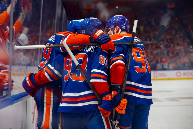 May 27, 2025; Edmonton, Alberta, CAN; Edmonton Oilers center Leon Draisaitl (29) and center Ryan Nugent-Hopkins (93) and right wing Corey Perry (90) celebrates Draisaitl scoring a power play goal against the Dallas Stars during the first period in game four of the Western Conference Final of the 2025 Stanley Cup Playoffs at Rogers Place. Mandatory Credit: Perry Nelson-Imagn Images