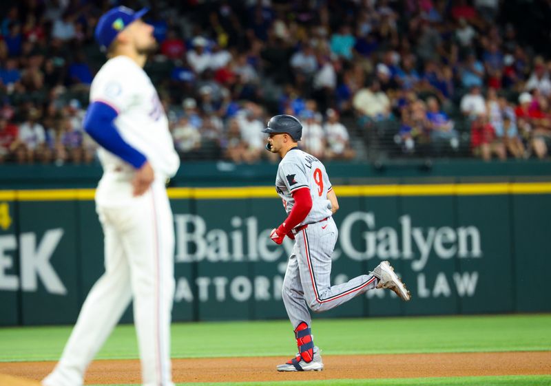 Aug 17, 2024; Arlington, Texas, USA;  Minnesota Twins left fielder Trevor Larnach (9) hits a home run and runs past Texas Rangers starting pitcher Nathan Eovaldi (17) during the fourth inning at Globe Life Field. Mandatory Credit: Kevin Jairaj-USA TODAY Sports