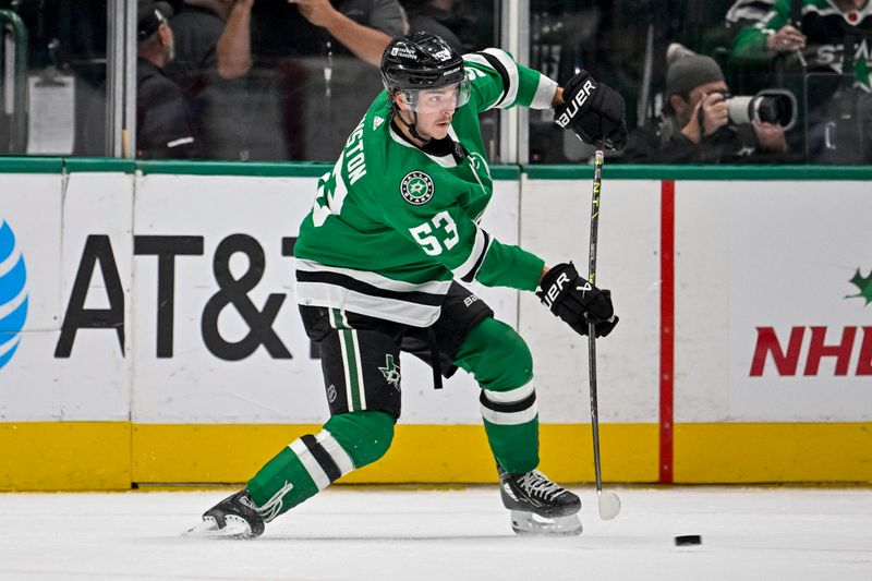 Nov 20, 2023; Dallas, Texas, USA; Dallas Stars center Wyatt Johnston (53) passes the puck in the New York Rangers zone during the first period at the American Airlines Center. Mandatory Credit: Jerome Miron-USA TODAY Sports