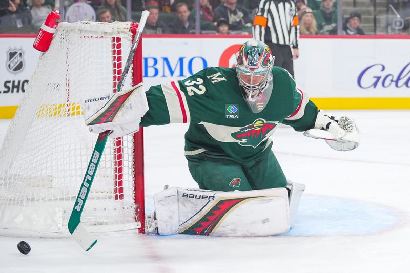 Nov 5, 2024; Saint Paul, Minnesota, USA; Minnesota Wild goaltender Filip Gustavsson (32) makes a save against the Los Angeles Kings in the first period at Xcel Energy Center. Mandatory Credit: Brad Rempel-Imagn Images