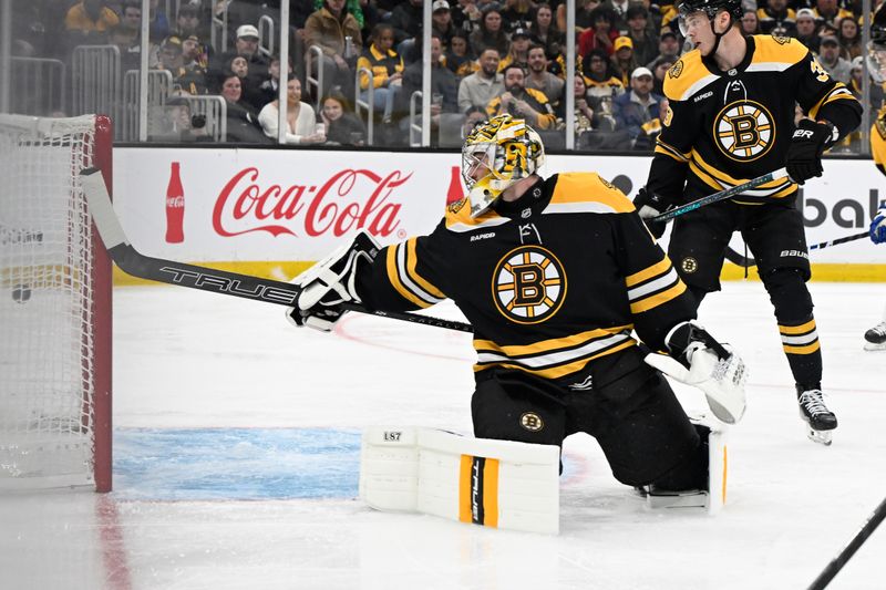 Mar 15, 2025; Boston, Massachusetts, USA; Boston Bruins goaltender Jeremy Swayman (1) looks back at the puck in the goal during the second period against the Tampa Bay Lightning at TD Garden. Mandatory Credit: Eric Canha-Imagn Images