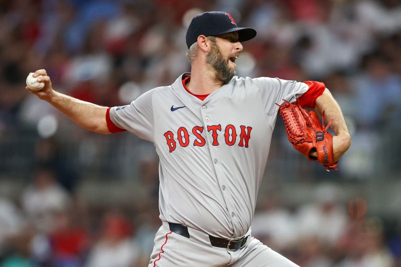 May 8, 2024; Atlanta, Georgia, USA; Boston Red Sox relief pitcher Chris Martin (55) throws against the Atlanta Braves in the seventh inning at Truist Park. Mandatory Credit: Brett Davis-USA TODAY Sports