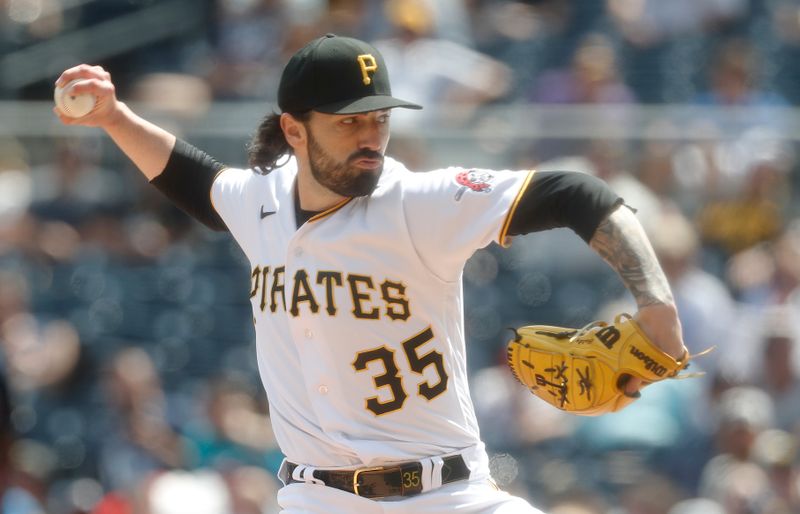 Aug 10, 2023; Pittsburgh, Pennsylvania, USA; Pittsburgh Pirates relief pitcher Colin Holderman (35) pitches against the Atlanta Braves during the ninth inning at PNC Park. Pittsburgh won 7-5. Mandatory Credit: Charles LeClaire-USA TODAY Sports