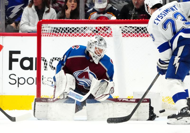 Nov 27, 2023; Denver, Colorado, USA; Tampa Bay Lightning center Michael Eyssimont (23) at Colorado Avalanche goaltender Alexandar Georgiev (40) in the second period at Ball Arena. Mandatory Credit: Ron Chenoy-USA TODAY Sports