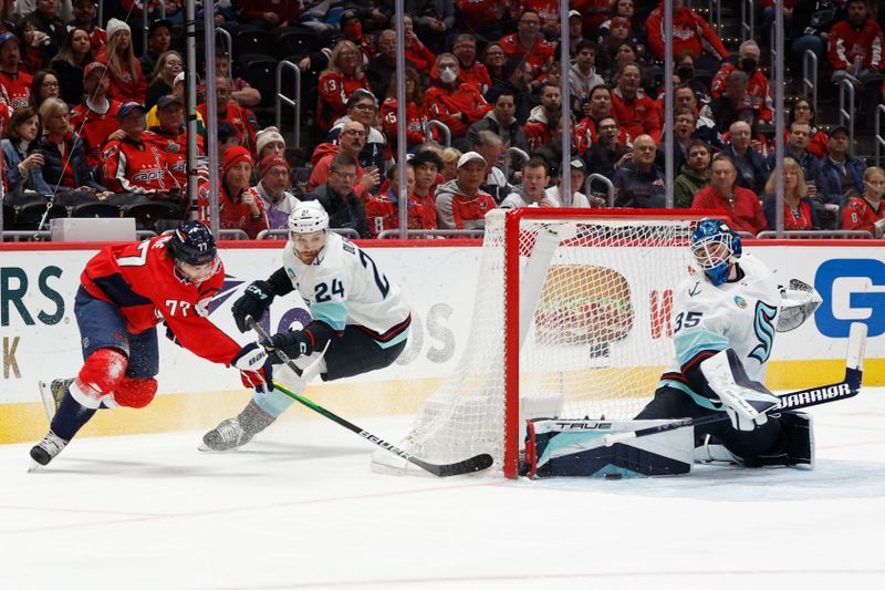 Jan 11, 2024; Washington, District of Columbia, USA; Seattle Kraken goaltender Joey Daccord (35) makes a save on Washington Capitals right wing T.J. Oshie (77) in the first period at Capital One Arena. Mandatory Credit: Geoff Burke-USA TODAY Sports