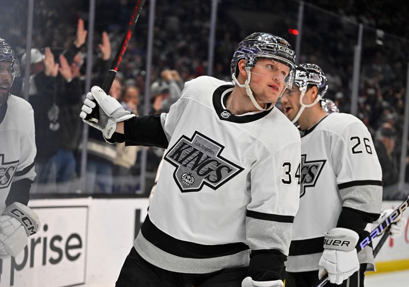 Apr 10, 2023; Los Angeles, California, USA;  Los Angeles Kings right wing Arthur Kaliyev (34) celebrates after scoring a goal in the second period against the Vancouver Canucks at Crypto.com Arena. Mandatory Credit: Jayne Kamin-Oncea-USA TODAY Sports