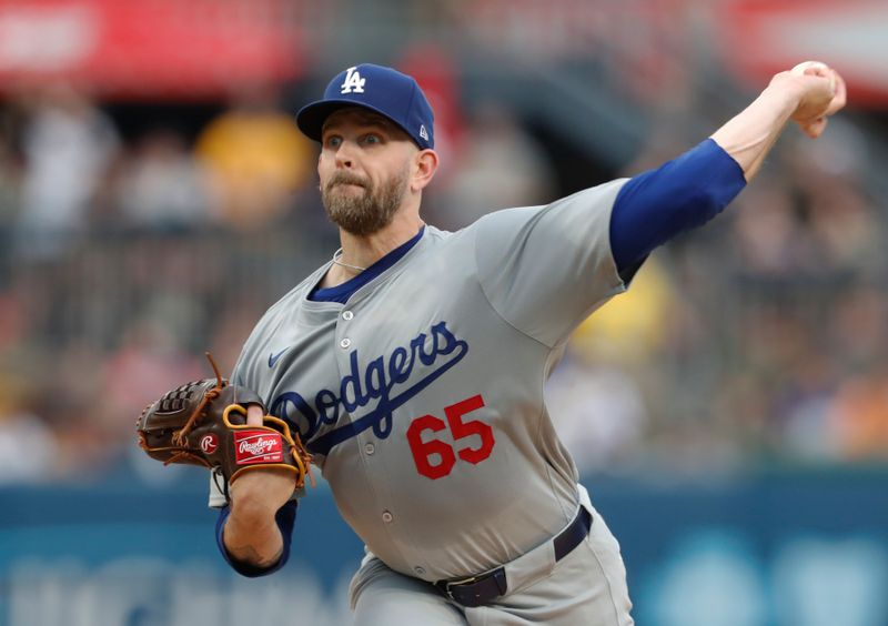 Jun 5, 2024; Pittsburgh, Pennsylvania, USA;  Los Angeles Dodgers starting pitcher James Paxton (65) delivers a pitch against the Pittsburgh Pirates during the first inning at PNC Park. Mandatory Credit: Charles LeClaire-USA TODAY Sports