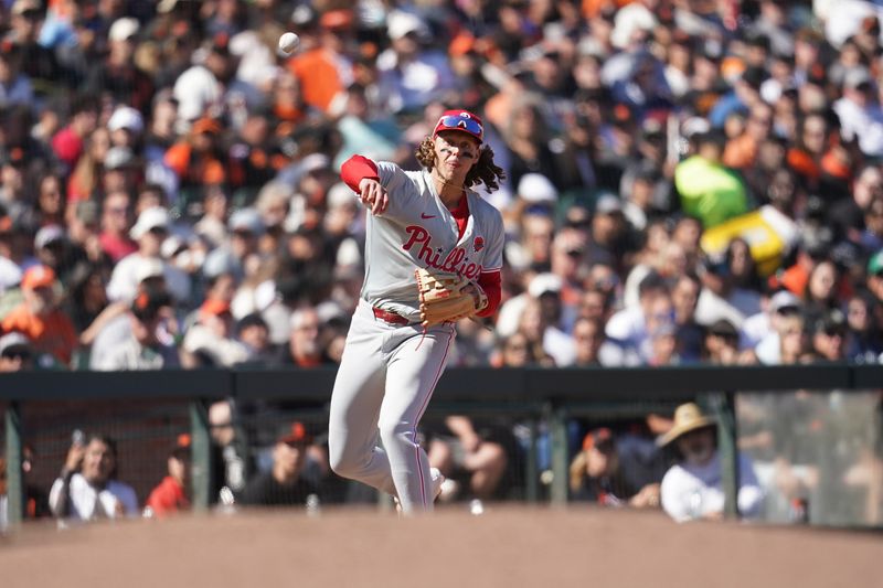 May 27, 2024; San Francisco, California, USA; Philadelphia Phillies third baseman Alec Bohm (28) is unable to throw out a base runner against the San Francisco Giants in the seventh inning at Oracle Park. Mandatory Credit: Cary Edmondson-USA TODAY Sports