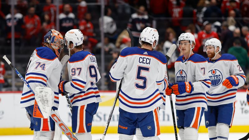 Nov 24, 2023; Washington, District of Columbia, USA; Edmonton Oilers goaltender Stuart Skinner (74) celebrates with Oilers center Connor McDavid (97) after their game against the Washington Capitals at Capital One Arena. Mandatory Credit: Geoff Burke-USA TODAY Sports