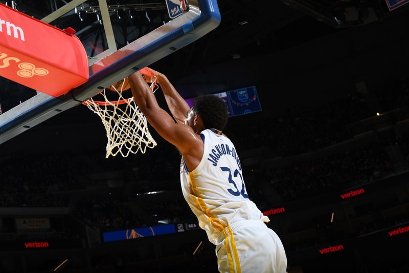 SAN FRANCISCO, CA - OCTOBER 13: Trayce Jackson-Davis #32 of the Golden State Warriors dunks the ball during the game against the Detroit Pistons during a NBA Preseason game on October 13, 2024 at Chase Center in San Francisco, California. NOTE TO USER: User expressly acknowledges and agrees that, by downloading and or using this photograph, user is consenting to the terms and conditions of Getty Images License Agreement. Mandatory Copyright Notice: Copyright 2024 NBAE (Photo by Noah Graham/NBAE via Getty Images)