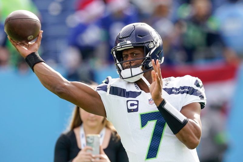 Seattle Seahawks quarterback Geno Smith warms for the team's NFL football game against the Tennessee Titans, Sunday, Dec. 24, 2023, in Nashville, Tenn. (AP Photo/George Walker IV)