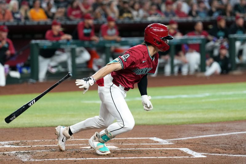 May 5, 2024; Phoenix, Arizona, USA; Arizona Diamondbacks outfielder Corbin Carroll (7) hits a two RBI single against the San Diego Padres during the first inning at Chase Field. Mandatory Credit: Joe Camporeale-USA TODAY Sports