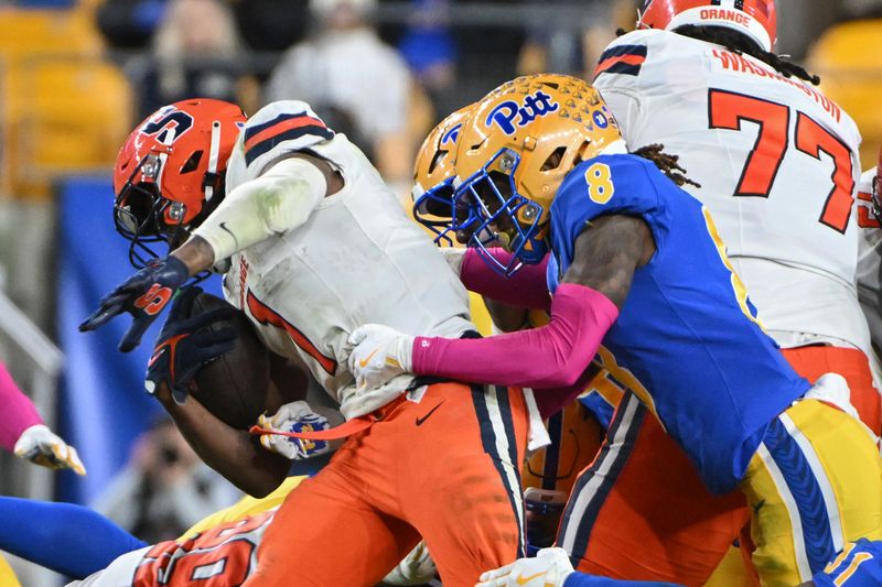 Oct 24, 2024; Pittsburgh, Pennsylvania, USA; Pittsburgh Panthers defensive back Tamon Lynum (8) tackles Syracuse Orange running back LeQuint Allen (1) during the third quarter at Acrisure Stadium. Mandatory Credit: Barry Reeger-Imagn Images